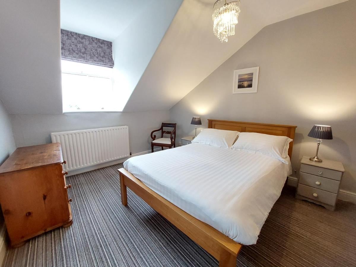 Attic double room with sloped ceiling and chandelier